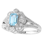 AQUAMARINE EMERALD CUT CENTER AND DIAMOND WHITE GOLD RING